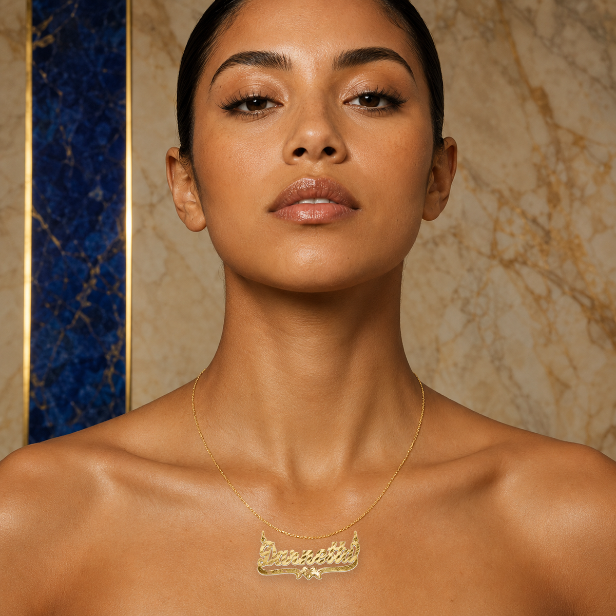 Darnetta 14K solid gold nameplate worn on the neck, shown at true size